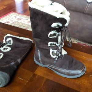 Kids 5 Nine West boots. Boots just below knees.